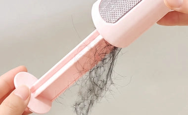 Collected hair falling out of the opened PAWOZA Clean collector